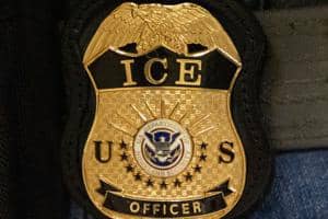 ICE Agent Surrenders After False Shooting Report